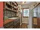 Charming kitchen with wooden cabinets, copper countertops, open shelving, and a bright window at 2008 Highway 92 S, Fayetteville, GA 30215