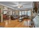 Spacious living room with hardwood flooring, fireplace and an open layout to the dining area at 2008 Highway 92 S, Fayetteville, GA 30215
