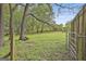 Fenced pasture offers ample space for livestock or recreational activities, enhancing the property's versatility at 2008 Highway 92 S, Fayetteville, GA 30215