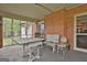 Spacious screened porch perfect for outdoor dining and entertaining, featuring a view of the lush yard at 2008 Highway 92 S, Fayetteville, GA 30215
