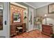 Charming vanity area featuring a wood-paneled accent wall with decorative lighting and vintage-style furniture at 2008 Highway 92 S, Fayetteville, GA 30215