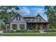 Charming gray two-story home with stone accents, covered porch, and professionally landscaped yard at 0 Pinegate Way, Sharpsburg, GA 30277