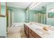 Bathroom featuring a soaking tub and double vanity sink at 675 Granby Hill Pl, Alpharetta, GA 30022