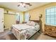 Bedroom with traditional furniture, ceiling fan and two windows at 675 Granby Hill Pl, Alpharetta, GA 30022