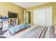 Bedroom with closet, tv, and comfortable bed at 675 Granby Hill Pl, Alpharetta, GA 30022