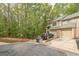 A townhouse with an attached garage, brick facade, and parking for one car at 675 Granby Hill Pl, Alpharetta, GA 30022