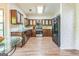 Traditional kitchen with wood cabinets, stainless steel appliances, and laminate floors at 675 Granby Hill Pl, Alpharetta, GA 30022
