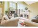 Bright and airy living room with fireplace, vaulted ceilings, and expansive windows at 675 Granby Hill Pl, Alpharetta, GA 30022