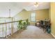 Upstairs loft area with a ceiling fan, natural light, and versatile space at 675 Granby Hill Pl, Alpharetta, GA 30022