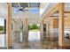 Spacious great room featuring wood beams, high ceilings, and an open floor plan with great lighting at 238 Indian Creek Rd, Locust Grove, GA 30248