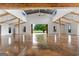 Expansive great room featuring high ceilings, exposed wood beams, and an open view to the outdoors at 238 Indian Creek Rd, Locust Grove, GA 30248