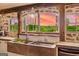 Charming kitchen with stone sink, wood accents, and serene outdoor views at 238 Indian Creek Rd, Locust Grove, GA 30248