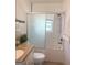 Bathroom featuring tiled walls, shower over tub and updated vanity with granite countertop at 6718 Delta Dr, Riverdale, GA 30274