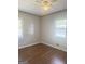 Comfortable bedroom with ample natural light, ceiling fan and durable laminate floors at 6718 Delta Dr, Riverdale, GA 30274