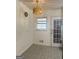 Bright dining area features a modern chandelier and a window, offering a cozy space for meals at 6718 Delta Dr, Riverdale, GA 30274