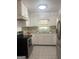 Functional kitchen featuring white cabinets, stainless steel appliances, and durable countertops at 6718 Delta Dr, Riverdale, GA 30274