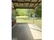 Covered concrete patio overlooking a spacious yard with a shed, perfect for outdoor relaxation and activities at 6718 Delta Dr, Riverdale, GA 30274