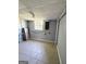 Unfinished basement with concrete walls, tiled floor, window and pipes at 6505 Allatoona Rd, Morrow, GA 30260