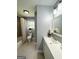 This bright bathroom features a tub/shower, toilet, modern vanity and natural light from the window at 6505 Allatoona Rd, Morrow, GA 30260