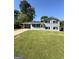 Charming two-story home featuring a well-manicured lawn and a convenient carport at 6505 Allatoona Rd, Morrow, GA 30260