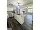 Modern kitchen with stainless steel appliances, granite countertops, and an island with a sink at 6505 Allatoona Rd, Morrow, GA 30260