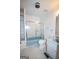Bathroom with glass enclosed shower, built-in shelves, and marble countertop sink at 2215 Mount Carmel Rd, Hampton, GA 30228