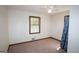 A simply decorated bedroom with neutral carpet and a ceiling fan at 2215 Mount Carmel Rd, Hampton, GA 30228