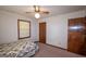 Bedroom features carpet flooring, neutral walls, and a classic quilt-covered bed at 2215 Mount Carmel Rd, Hampton, GA 30228