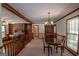 Open living space with a dining area, brick fireplace, and hardwood floors at 2215 Mount Carmel Rd, Hampton, GA 30228