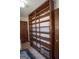 Spacious laundry room features large, built-in wooden shelving and tile flooring at 2215 Mount Carmel Rd, Hampton, GA 30228