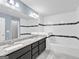 Primary bathroom with double sink vanity, decorative tiling, and soaking tub at 488 Jefferson Chase St, Atlanta, GA 30354