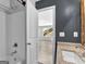 Bright bathroom boasting modern fixtures, a clean white shower, and an inviting doorway to the bedroom at 488 Jefferson Chase St, Atlanta, GA 30354