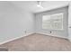 Bedroom featuring soft carpeting, bright windows, and neutral walls for versatile décor options at 488 Jefferson Chase St, Atlanta, GA 30354