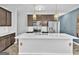 Bright kitchen featuring a center island with sink, stainless steel appliances, and modern cabinetry at 488 Jefferson Chase St, Atlanta, GA 30354