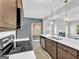 Modern kitchen with stainless appliances, quartz countertops, and a view of the open-concept living space at 488 Jefferson Chase St, Atlanta, GA 30354