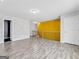 Open loft area features light wood floors, gray accent wall, and stairway at 488 Jefferson Chase St, Atlanta, GA 30354