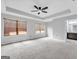 Main bedroom with tray ceiling, natural light and carpeted flooring at 488 Jefferson Chase St, Atlanta, GA 30354