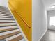 Staircase with wooden banister, leading to the upper level, offers stylish transition between floors at 488 Jefferson Chase St, Atlanta, GA 30354