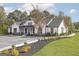 Exterior view of the community clubhouse showcasing its farmhouse style design at 1033 Claas Way, Locust Grove, GA 30248