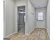 Open entryway view, showing a coat rack, flooring, and interior doors at 130 S Meadows Ridge Dr, Grantville, GA 30220