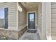 Close-up of the front door with sidelight, showing the entry to the home at 130 S Meadows Ridge Dr, Grantville, GA 30220