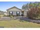 Charming single-story home with well-maintained lawn, landscaping, and neutral siding and trim at 130 S Meadows Ridge Dr, Grantville, GA 30220