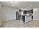 Open kitchen design with stainless appliances, a large island, and granite countertops at 130 S Meadows Ridge Dr, Grantville, GA 30220