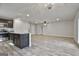 Open kitchen layout with a central island bar area and hardwood flooring at 130 S Meadows Ridge Dr, Grantville, GA 30220