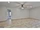 Open concept living space with a ceiling fan and an entry to another room at 130 S Meadows Ridge Dr, Grantville, GA 30220