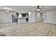 Bright living space featuring hardwood floors, stainless steel appliances and pendant lighting at 130 S Meadows Ridge Dr, Grantville, GA 30220