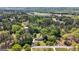 Aerial view of a house nestled among trees, showcasing its location in a serene, wooded neighborhood at 25 Hickory Dr, Stockbridge, GA 30281