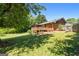A spacious backyard with a wooden deck and patio, ideal for outdoor entertaining and relaxation at 25 Hickory Dr, Stockbridge, GA 30281