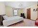 Bedroom with carpet, one window, a bed with a white bedspread and a TV on a stand at 25 Hickory Dr, Stockbridge, GA 30281