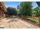 Exterior view of the home's wooden deck with metal patio table and chairs at 25 Hickory Dr, Stockbridge, GA 30281